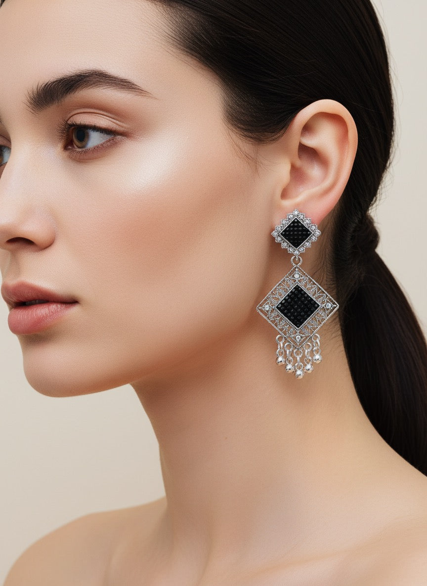 Silver and black earring