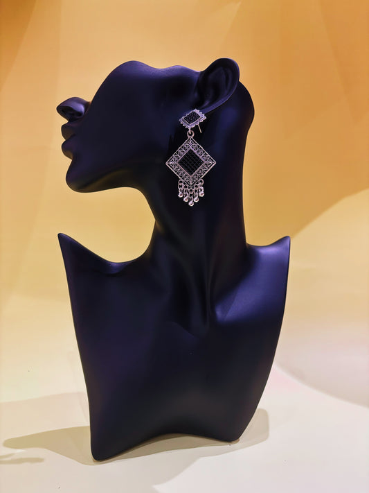 Silver and black earring